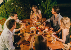 a group of people having dinner