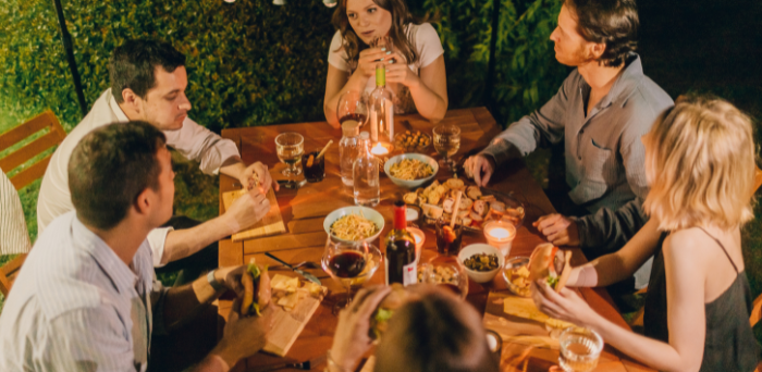 a group of people having dinner