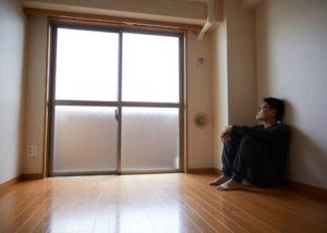 man sitting in a room alone